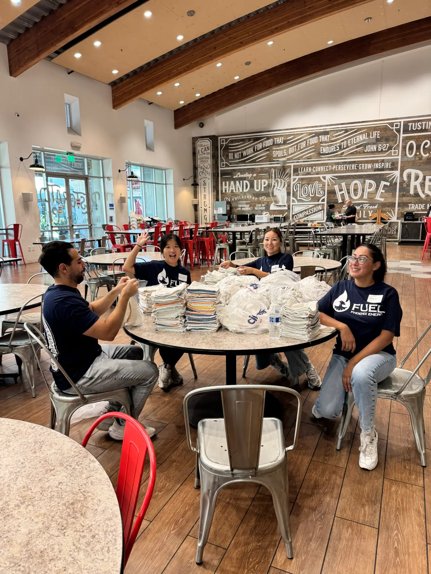 Phoenix Energy team members volunteer at Orange County Rescue Mission's kitchen