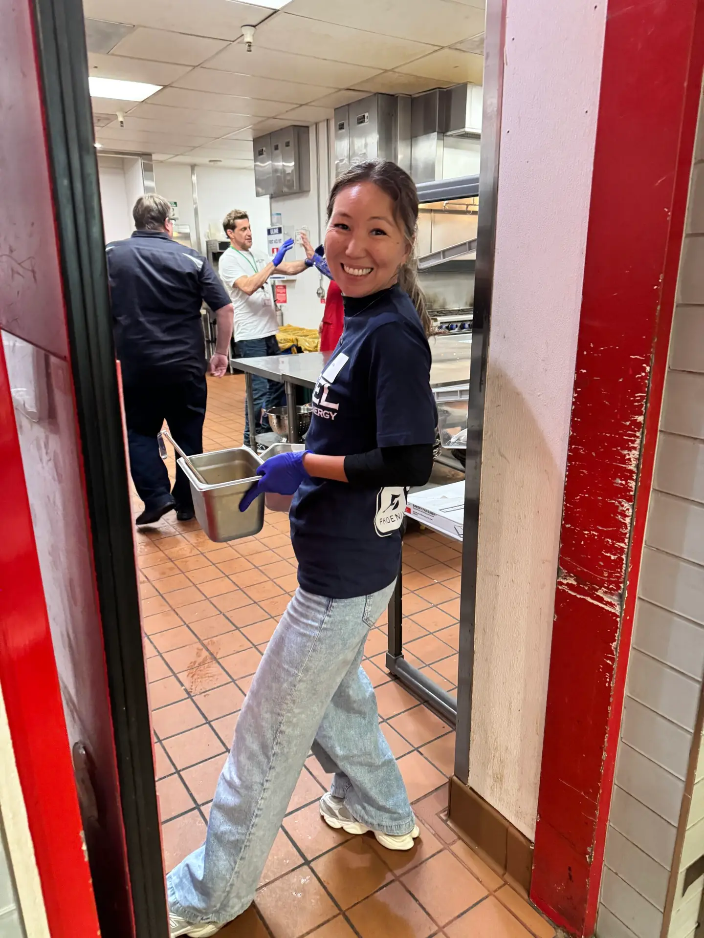 Phoenix Energy team members volunteer at Orange County Rescue Mission's kitchen