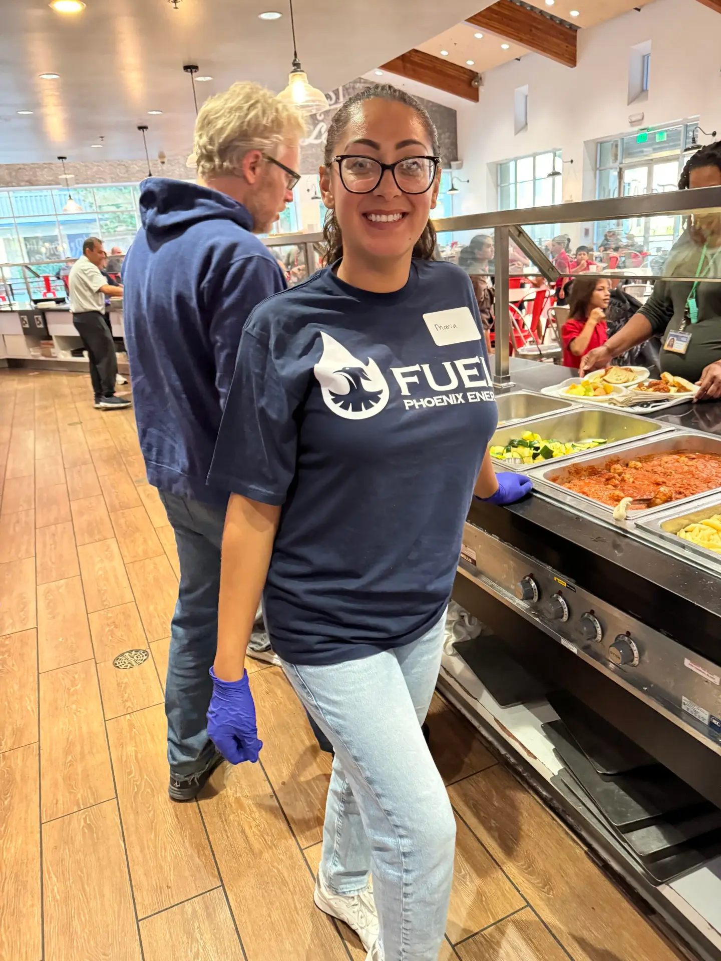 Phoenix Energy team members volunteer at Orange County Rescue Mission's kitchen