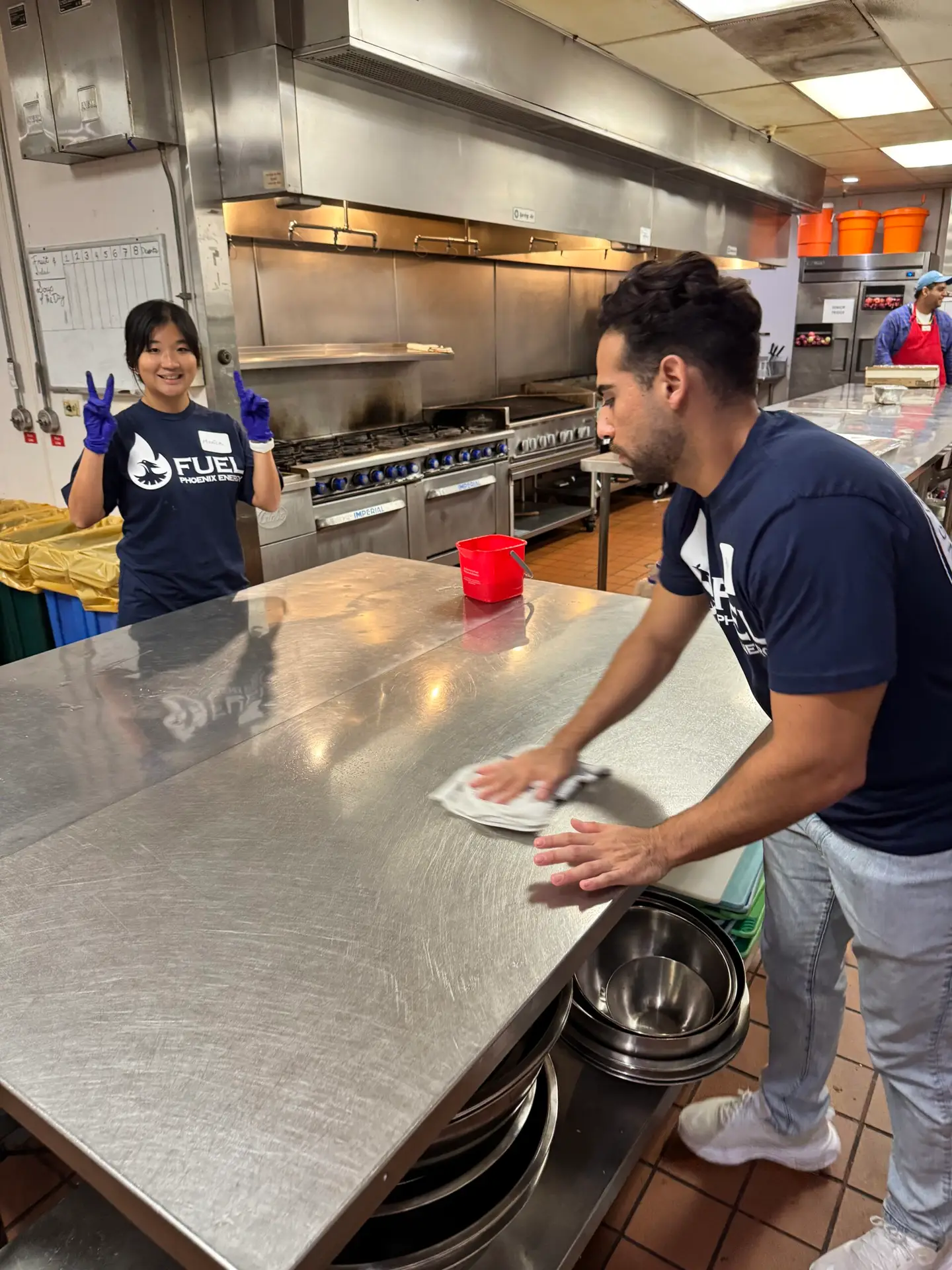 Phoenix Energy team members volunteer at Orange County Rescue Mission's kitchen